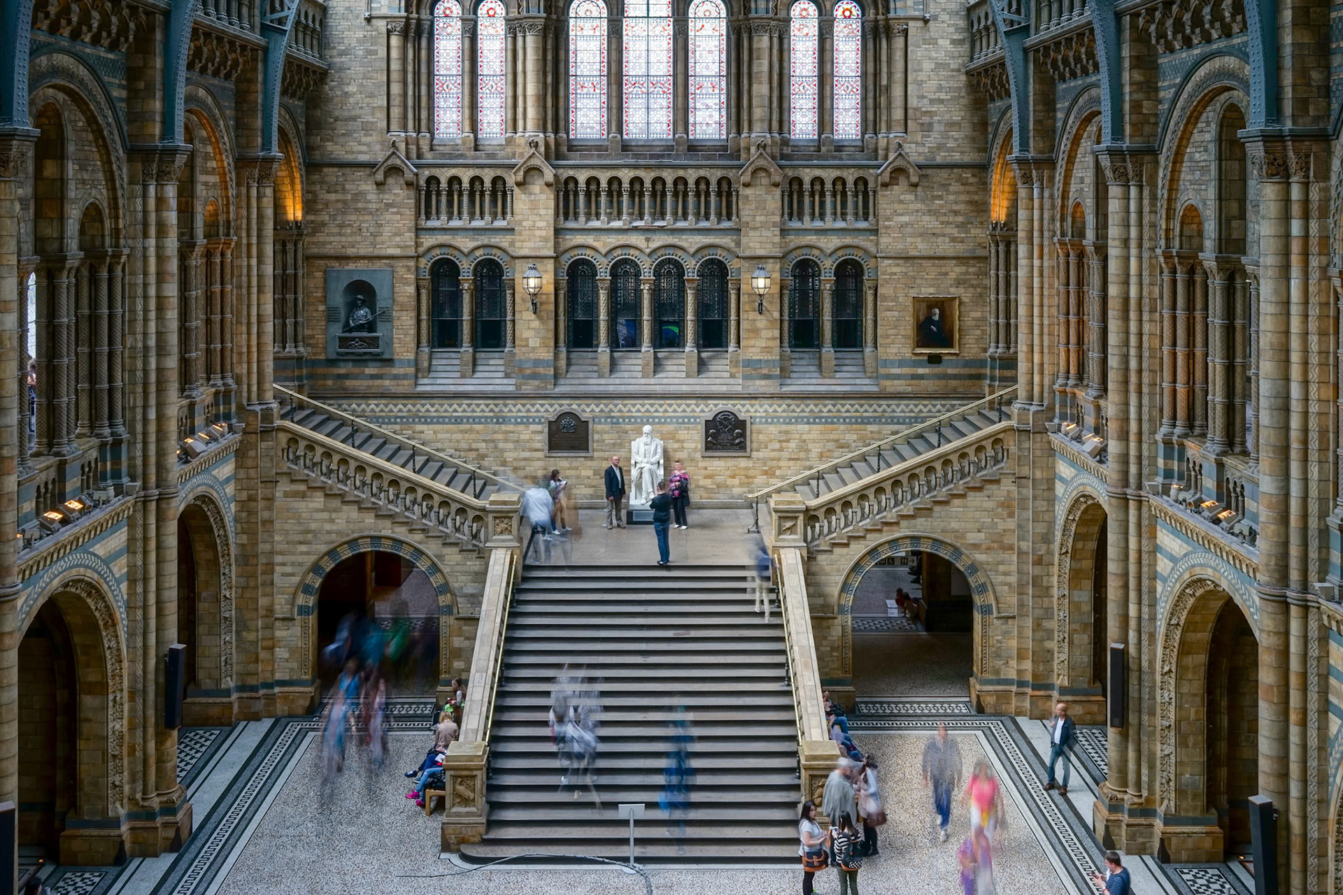 People on a Staircase in the National History Museum in London