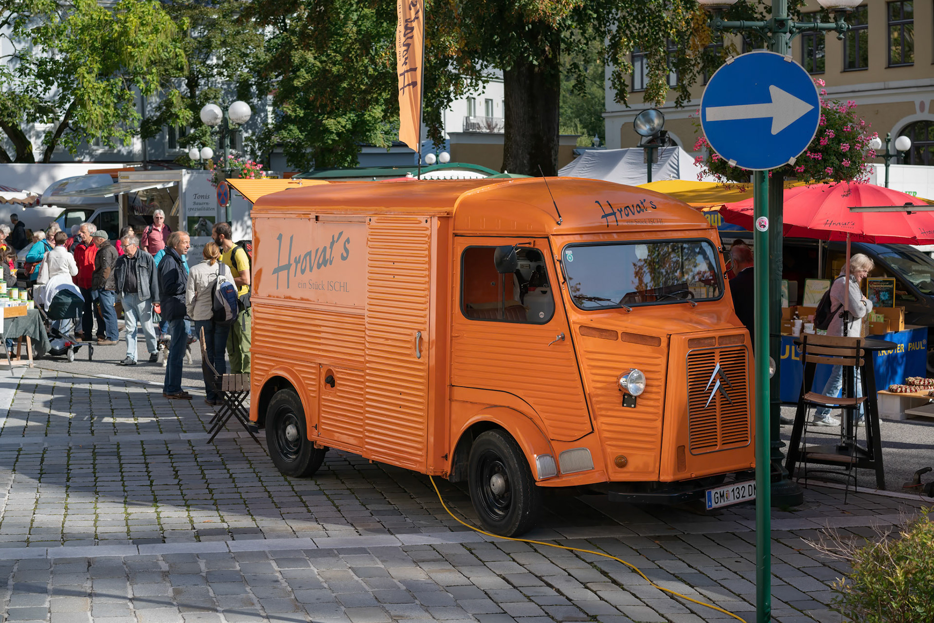 BAD ISCHL, SALZKAMMERGUT, AUSTRIA - SEPTEMBER 14. Orange Van in the Market Square in Bad Ischl on September 15, 2017. Unidentified people