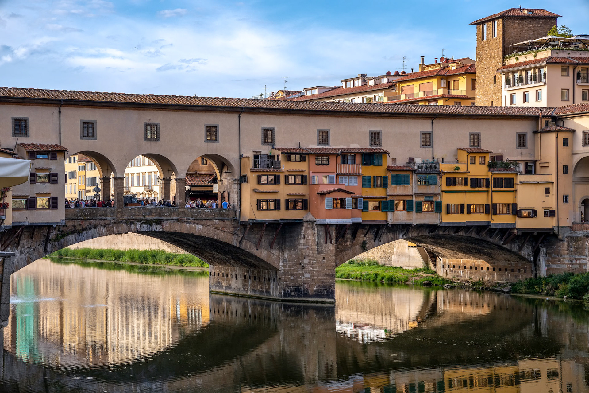 FLORENCE, TUSCANY/ITALY - OCTOBER 18 : View of buildings along and across the River Arno in Florence  on October 18, 2019. Unidentified people.