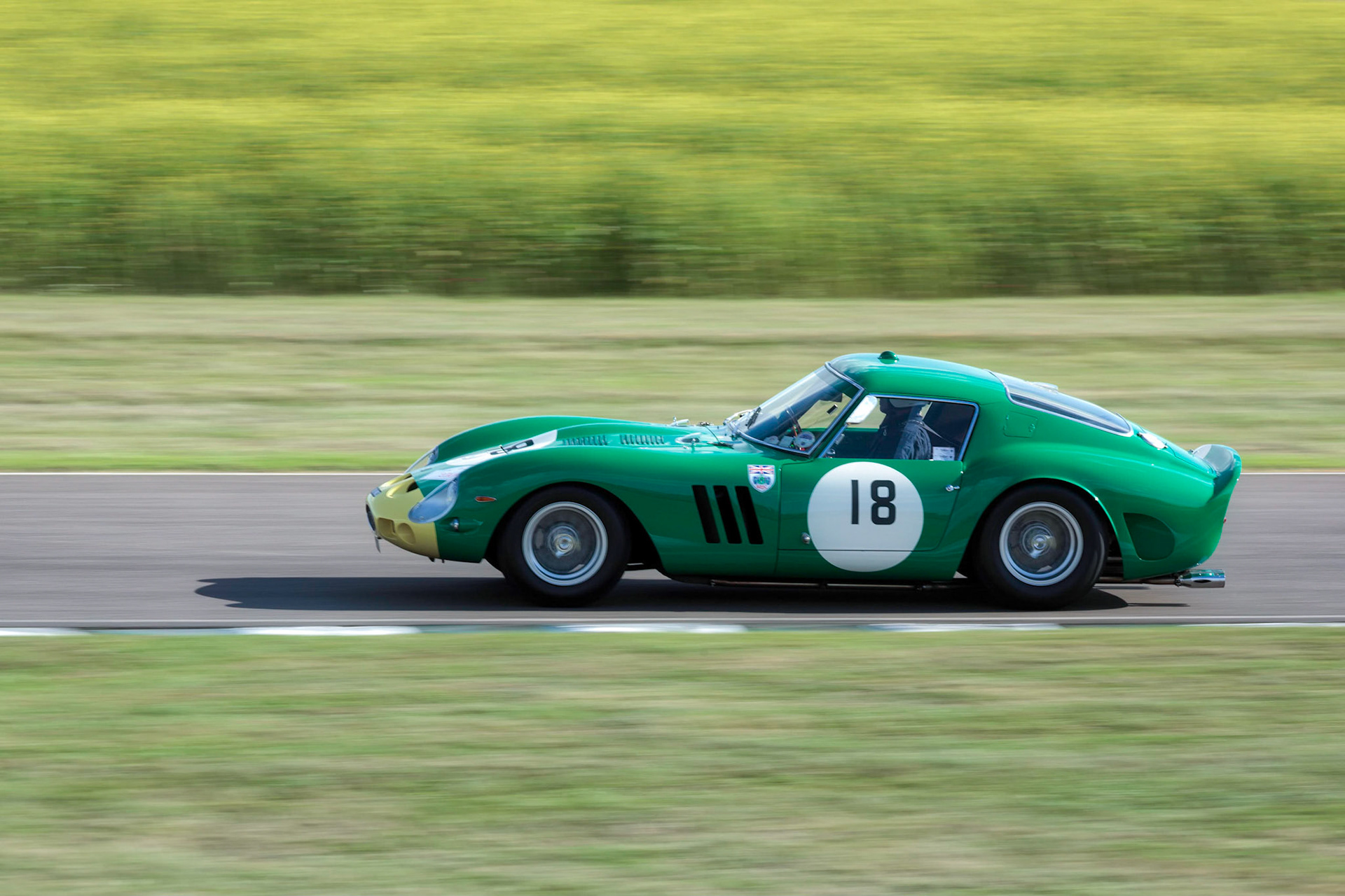 GOODWOOD, WEST SUSSEX/UK - SEPTEMBER 14 : Vintage Racing at Goodwood West Sussex on September 14, 2012. One unidentified person