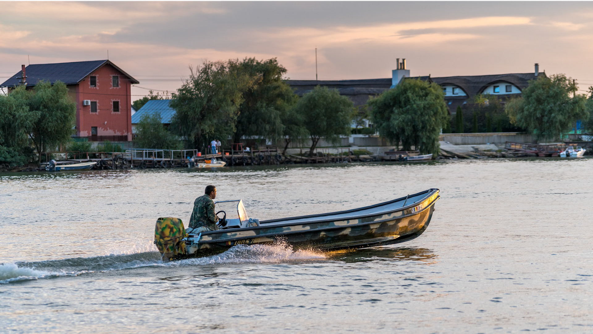 TULCEA, DANUBE DELTA/ROMANIA - SEPTEMBER 22 : High speed boat  travelling from Tulcea Danube Delta Romania on September 22, 2018. Unidentified person